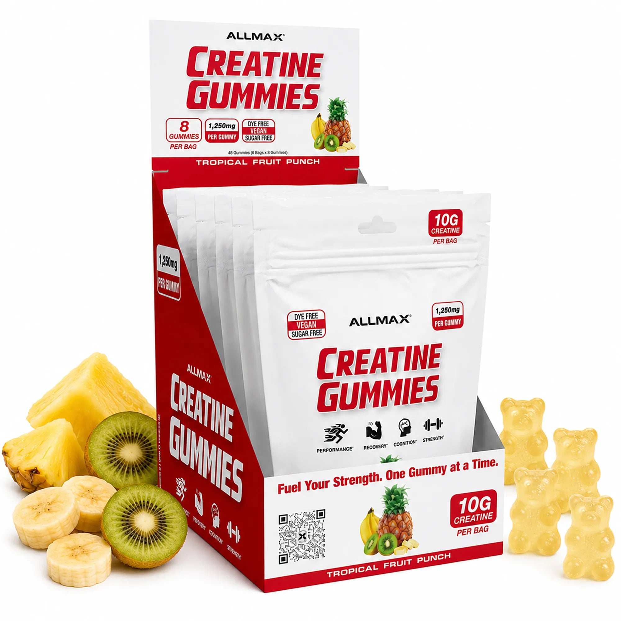 ALLMAX Creatine Gummies Tropical Fruit Punch flavor, shown in a white and red display box with individual pouches, alongside pineapple, kiwi, banana slices, and yellow gummy bears on a white background.