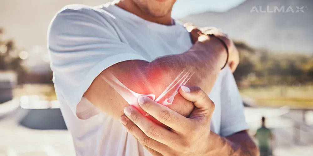 a man holding his elbow joint