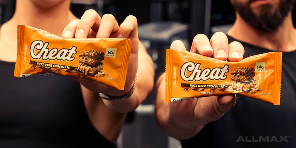 a man and woman each holding a Cheat Bar