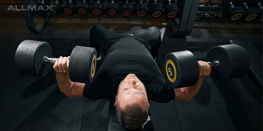 A man doing a dumbbell chest press